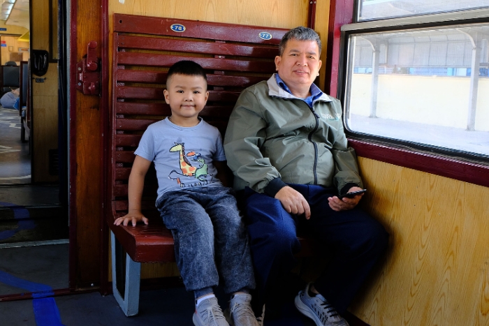 Mr. Nguyen Hoang Tuyen and his 6-year-old grandson took the train from Hanoi to Gia Lam station